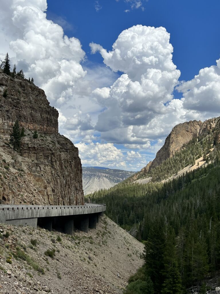 View of road between mountains in Yellowstone