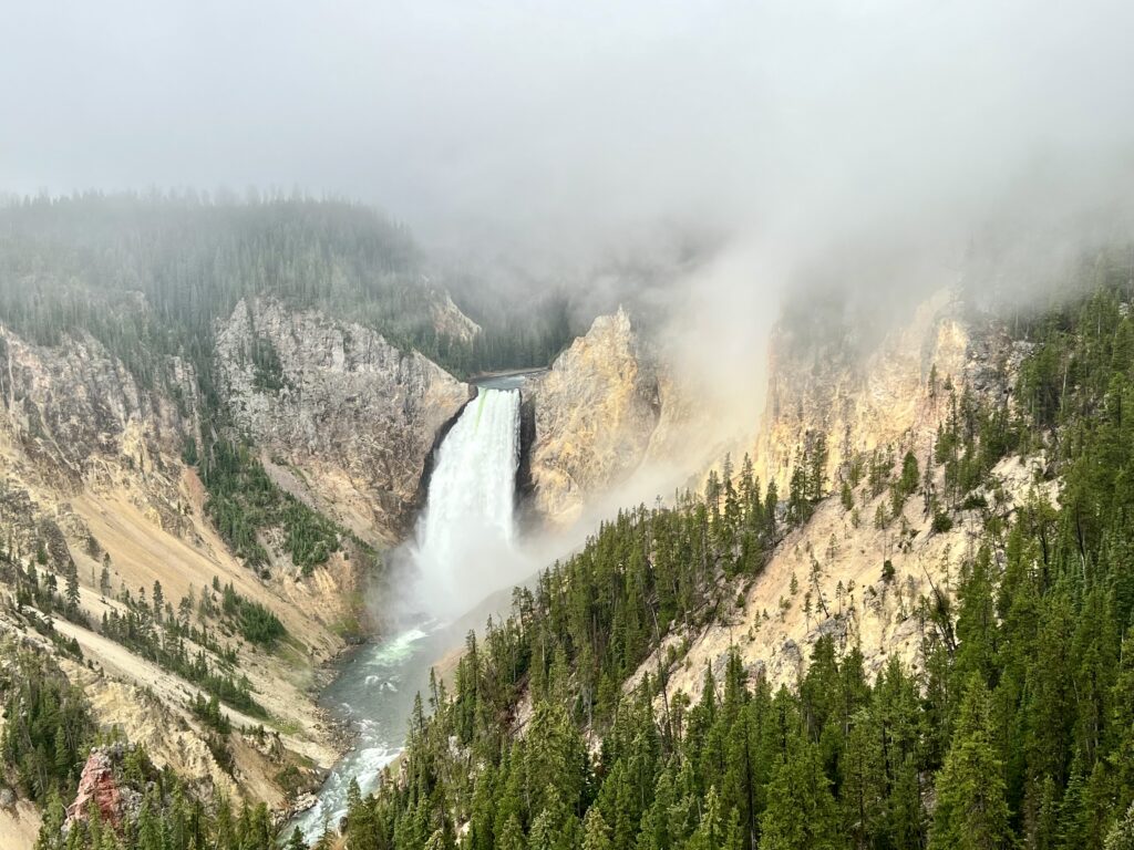 Waterfall pouring into canyon in Grand Canyon of Yellowstone National Park