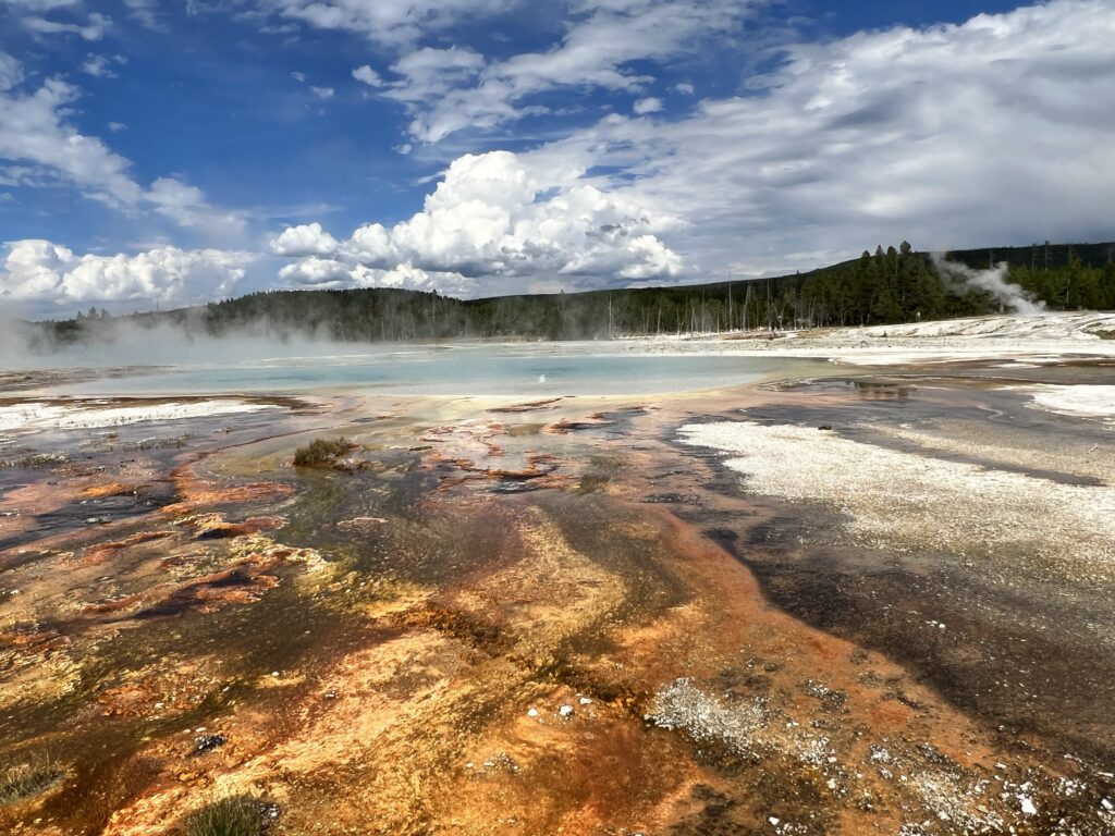orange and blue colored geothermal feature at Yellowstone national park